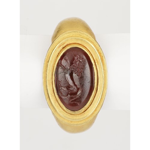 A Fine Greek Finger Ring Set with a Garnet Intaglio of a Lion